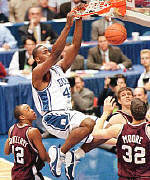 Duke's number 1 draft choice, Elton Brand, pokes it!